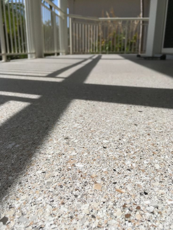 Expertly polished concrete surface featuring a high-quality resin rich floors finish with a smooth and durable appearance.