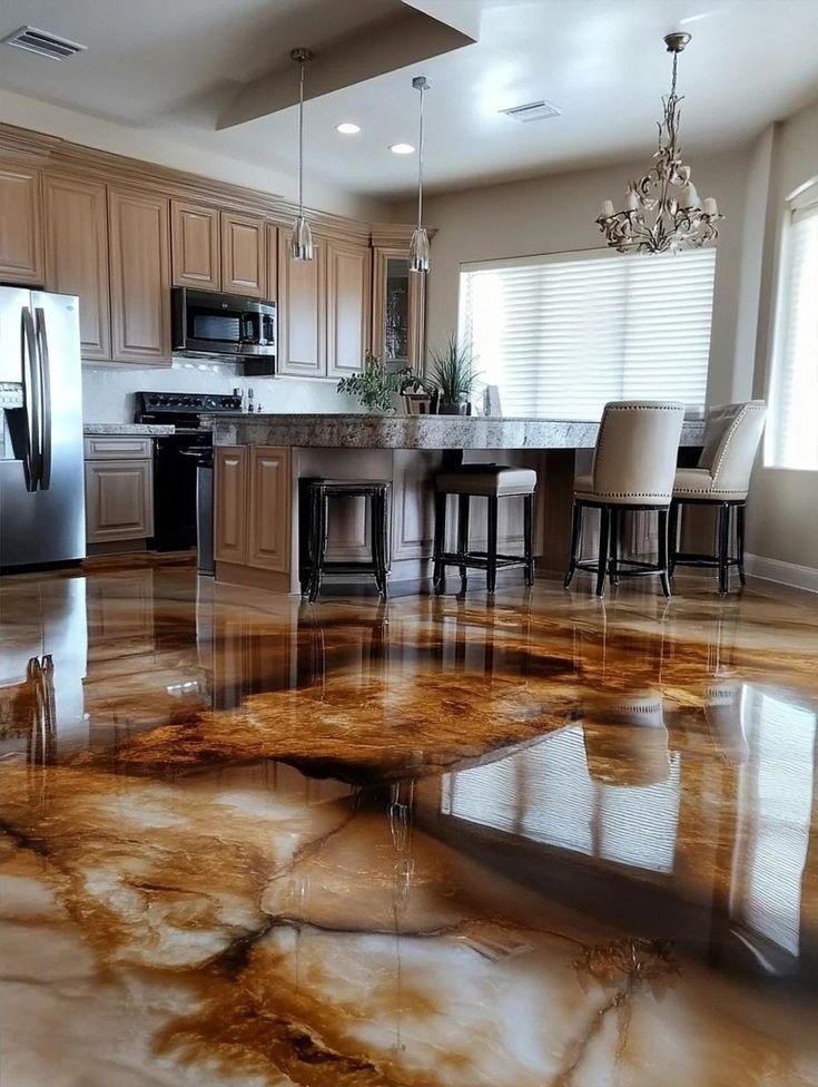 Glossy resin rich floors in a modern kitchen, featuring premium epoxy flooring with a warm amber finish for a stylish and durable look.