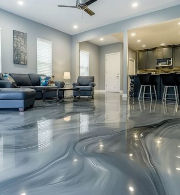 Modern living room with glossy resin rich floors featuring grey metallic residential epoxy flooring in Melbourne.