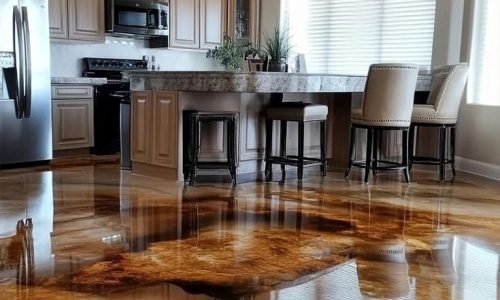 Glossy resin rich floors in a modern kitchen, featuring premium epoxy flooring with a warm amber finish for a stylish and durable look.