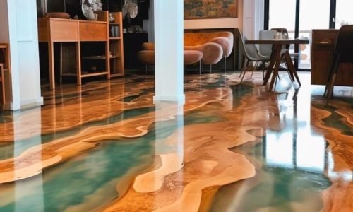 Residential epoxy flooring in Melbourne – glossy resin rich floors in light brown and sea green for luxury living rooms.
