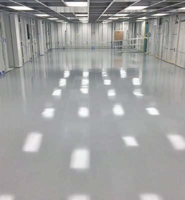 Smooth, high-gloss resin rich floors with light grey warehouse epoxy flooring in Melbourne